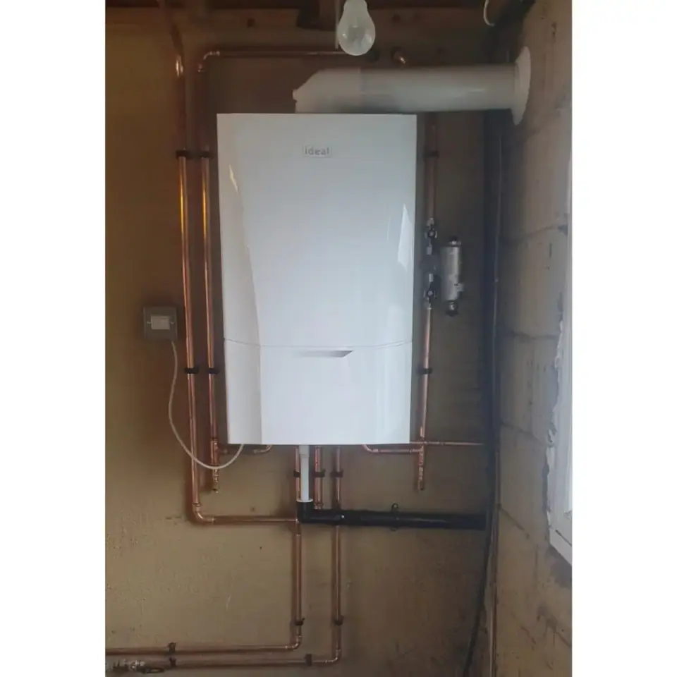 Wall-hung Ideal boiler with copper pipework and flue, installed by EFW Gas